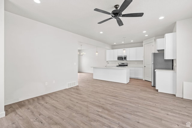 688 E 500 S Unit 108, Provo, UT 84606 - kitchen with stainless steel appliances, light wood-style flooring, recessed lighting, white cabinetry, and light countertops