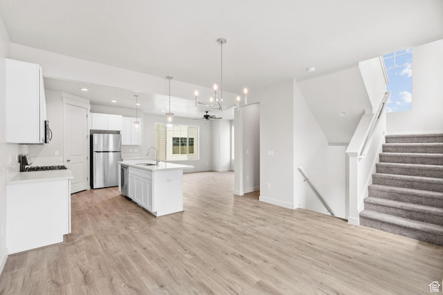 688 E 500 S Unit 108, Provo, UT 84606 - kitchen with stainless steel appliances, open floor plan, light wood-style floors, and recessed lighting