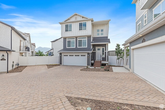 4397 W Bromwell Ct, Lehi, UT 84043 - view of front facade with board and batten siding, decorative driveway, and an attached garage