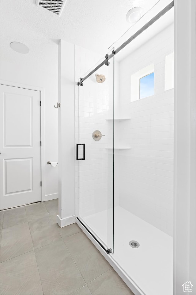 4397 W Bromwell Ct, Lehi, UT 84043 - bathroom featuring a shower stall and tile patterned flooring