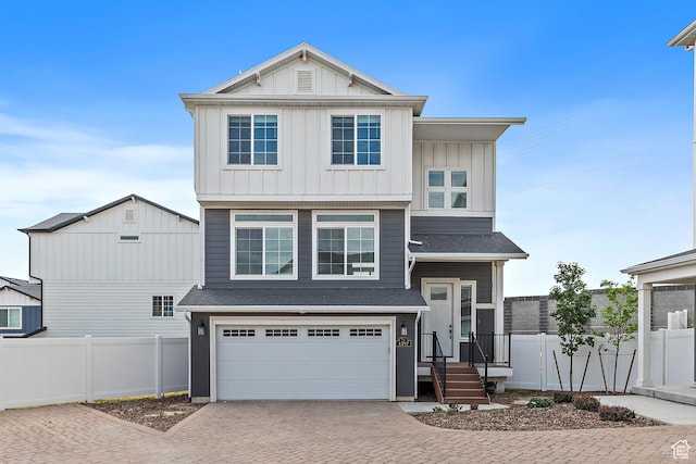 4397 W Bromwell Ct, Lehi, UT 84043 - view of front of home featuring board and batten siding, decorative driveway, an attached garage, and roof with shingles