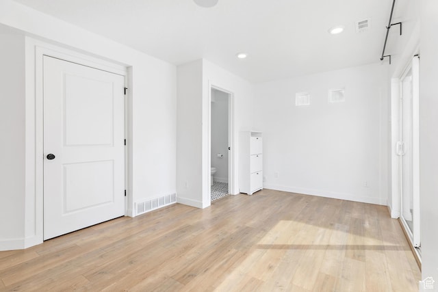 4397 W Bromwell Ct, Lehi, UT 84043 - unfurnished bedroom featuring light wood-style floors, recessed lighting, and connected bathroom