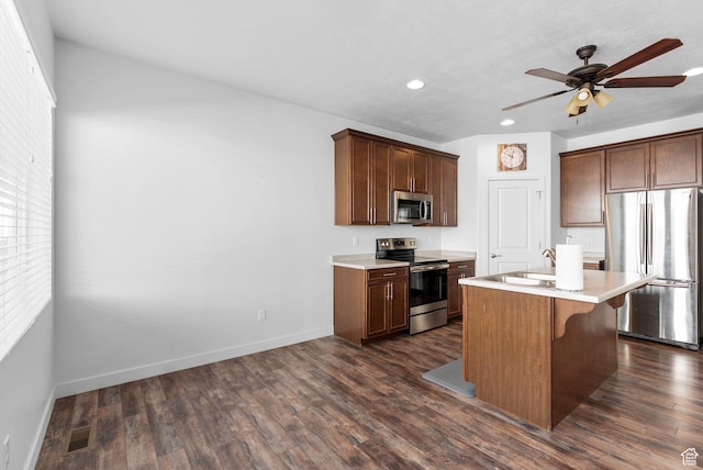 15218 S Tack Way, Bluffdale, UT 84065 - kitchen featuring stainless steel appliances, recessed lighting, light countertops, a ceiling fan, and dark wood finished floors