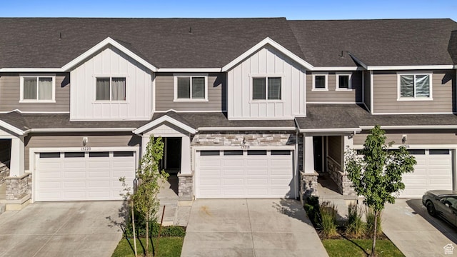 15218 S Tack Way, Bluffdale, UT 84065 - multi unit property featuring board and batten siding, stone siding, concrete driveway, and an attached garage