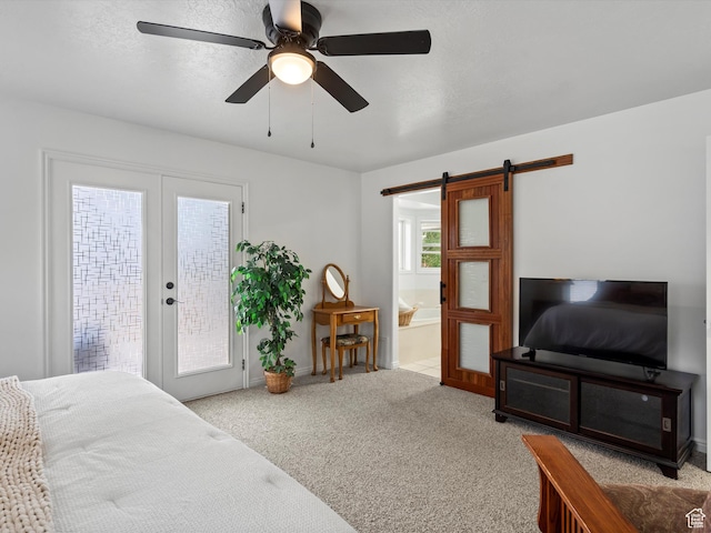 4829 E Patio Springs Cir N, Eden, UT 84310 - carpeted bedroom featuring a barn door, access to exterior, ensuite bathroom, and ceiling fan