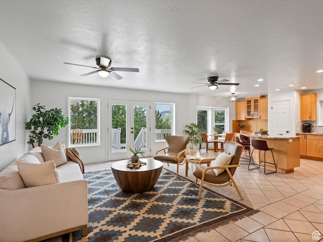 4829 E Patio Springs Cir N, Eden, UT 84310 - living room featuring a ceiling fan, healthy amount of natural light, light tile patterned flooring, recessed lighting, and french doors