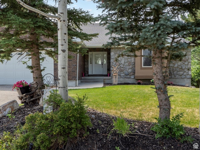4829 E Patio Springs Cir N, Eden, UT 84310 - obstructed view of property featuring a front lawn, stone siding, and roof with shingles