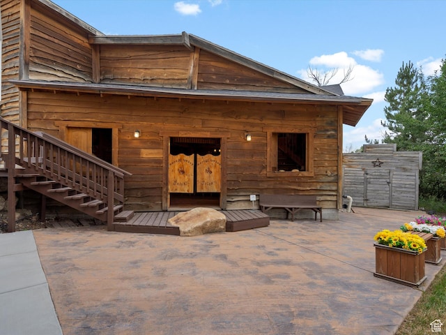 4829 E Patio Springs Cir N, Eden, UT 84310 - back of house featuring a patio and stairway
