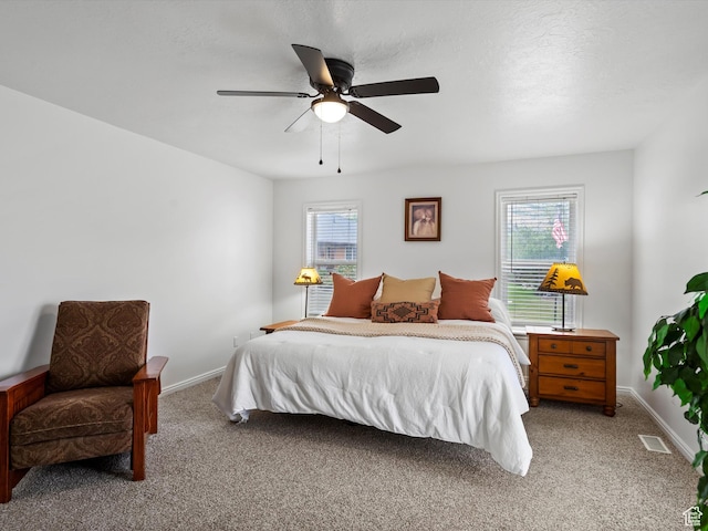 4829 E Patio Springs Cir N, Eden, UT 84310 - bedroom featuring multiple windows, light carpet, and a ceiling fan