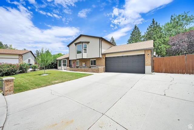 6337 S Coybrook Dr, Taylorsville, UT 84129 - tri-level home with brick siding, a garage, and concrete driveway