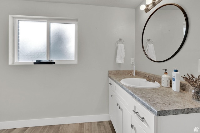 6337 S Coybrook Dr, Taylorsville, UT 84129 - bathroom featuring vanity and wood finished floors