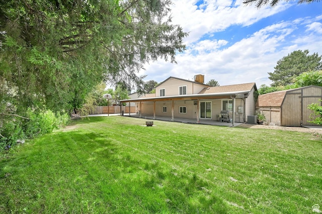 6337 S Coybrook Dr, Taylorsville, UT 84129 - rear view of property with a patio area, a storage shed, and a chimney
