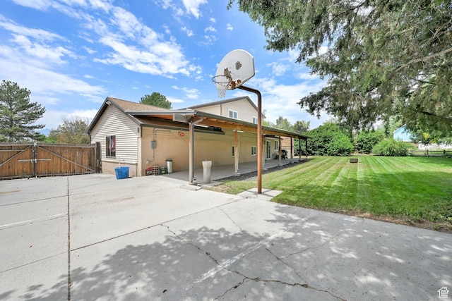 6337 S Coybrook Dr, Taylorsville, UT 84129 - back of property featuring a gate and a patio