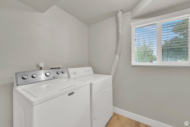 6337 S Coybrook Dr, Taylorsville, UT 84129 - laundry room with washer and clothes dryer and light wood-style flooring