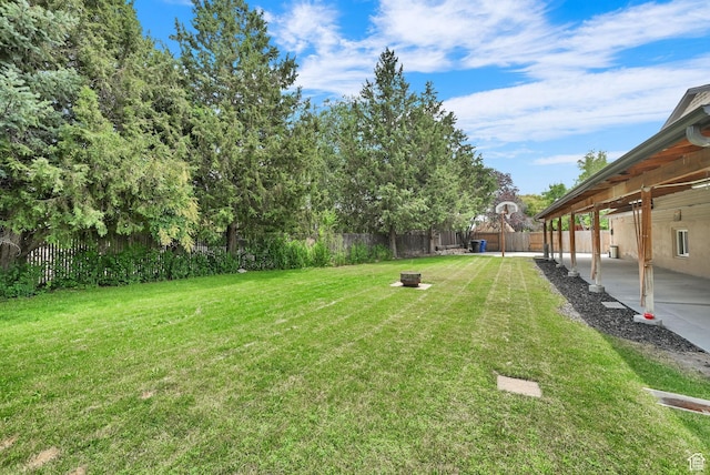 6337 S Coybrook Dr, Taylorsville, UT 84129 - fenced backyard featuring a fire pit and a patio area