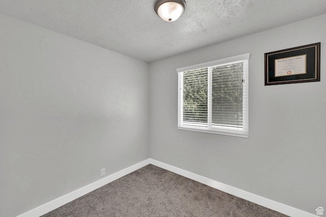 6337 S Coybrook Dr, Taylorsville, UT 84129 - carpeted spare room featuring baseboards and a textured ceiling