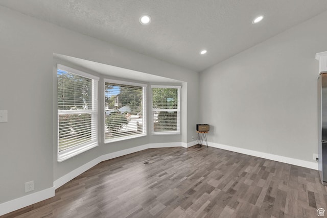 6337 S Coybrook Dr, Taylorsville, UT 84129 - spare room featuring wood finished floors and recessed lighting