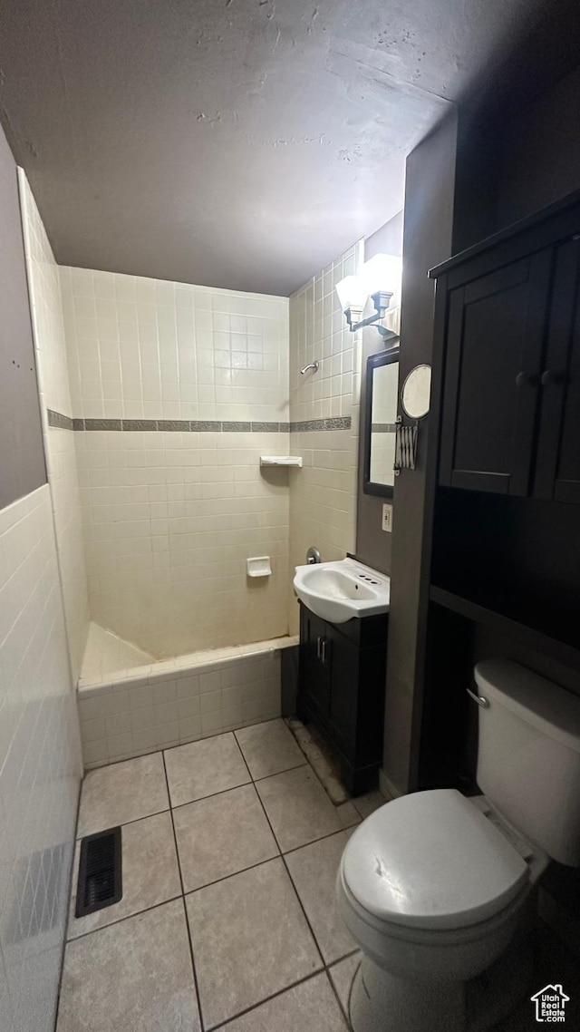 249 N Broadway St E, Tooele, UT 84074 - full bathroom with vanity, tile patterned floors, a tub, and a shower