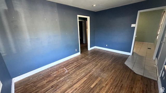 249 N Broadway St E, Tooele, UT 84074 - spare room with wood finished floors and baseboards