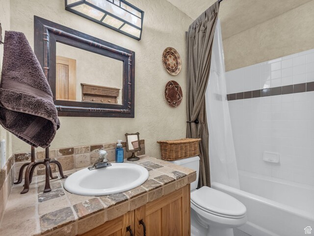 8998 Timphaven Rd, Sundance, UT 84604 - bathroom with a textured wall, vanity, and shower / bath combination with curtain