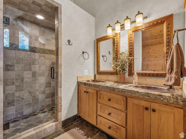 8998 Timphaven Rd, Sundance, UT 84604 - full bathroom featuring a textured wall, double vanity, and a stall shower