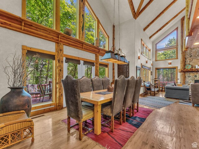 8998 Timphaven Rd, Sundance, UT 84604 - dining space with high vaulted ceiling, hardwood / wood-style flooring, and beamed ceiling