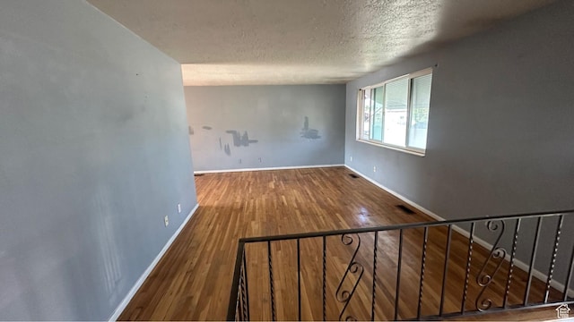 4220 S 2075 W, Roy, UT 84067 - spare room with a textured ceiling and wood finished floors