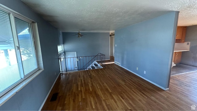 4220 S 2075 W, Roy, UT 84067 - unfurnished room with a textured ceiling, wood finished floors, and a ceiling fan