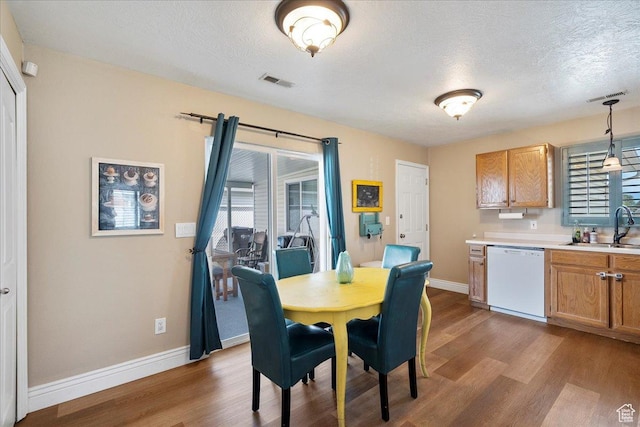 3042 S Festival Dr W, West Valley City, UT 84120 - dining room with dark wood-style floors and a textured ceiling