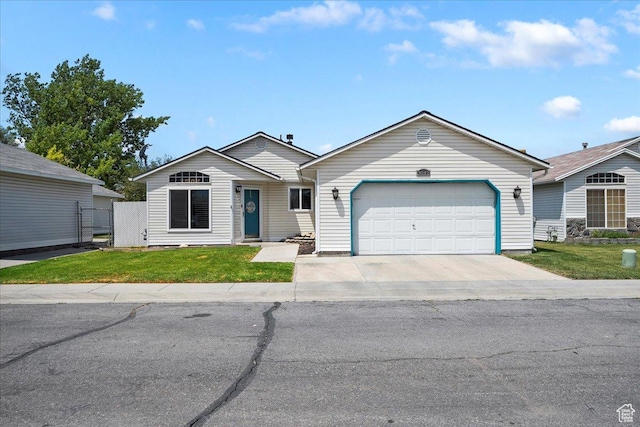 3042 S Festival Dr W, West Valley City, UT 84120 - ranch-style house with a garage, a front lawn, and concrete driveway