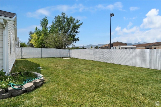 3042 S Festival Dr W, West Valley City, UT 84120 - fenced backyard with a mountain view