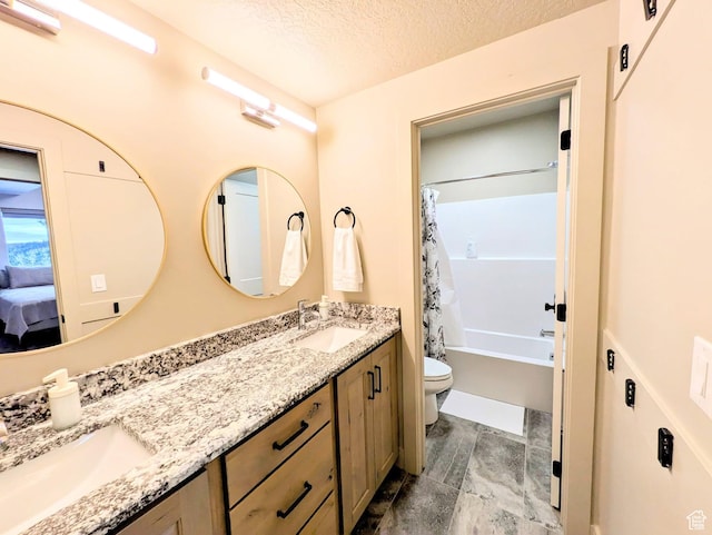 251 N Summit Dr, Beaver, UT 84713 - full bathroom featuring double vanity, shower / bath combination with curtain, a textured ceiling, and connected bathroom