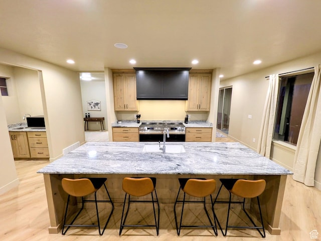 251 N Summit Dr, Beaver, UT 84713 - kitchen with stainless steel electric range oven, a kitchen breakfast bar, light wood-style flooring, recessed lighting, and a large island