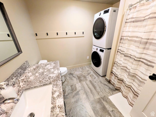 251 N Summit Dr, Beaver, UT 84713 - washroom featuring estacked washer and dryer and light marble finish floors