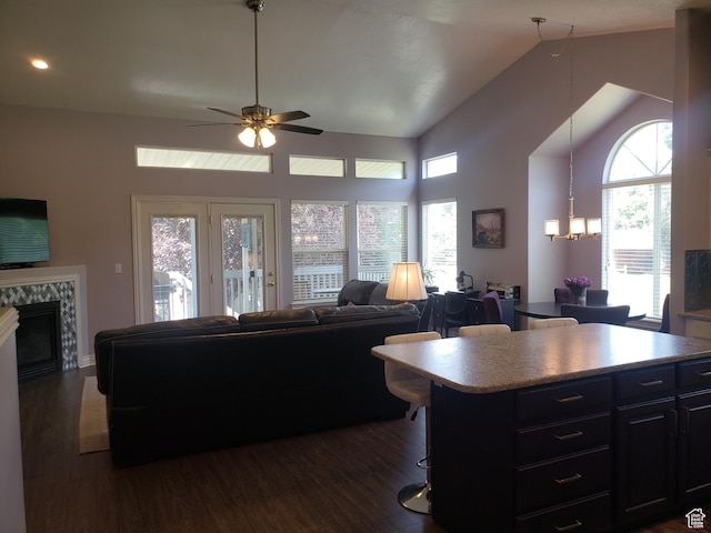 62 S 100 E, Kaysville, UT 84037 - living area featuring dark wood-style flooring, a fireplace, a ceiling fan, plenty of natural light, and recessed lighting