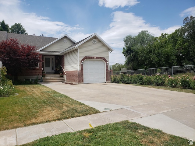 62 S 100 E, Kaysville, UT 84037 - view of front of house featuring concrete driveway, an attached garage, and brick siding