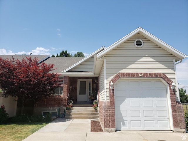 62 S 100 E, Kaysville, UT 84037 - view of front of property featuring a garage, a shingled roof, concrete driveway, and brick siding