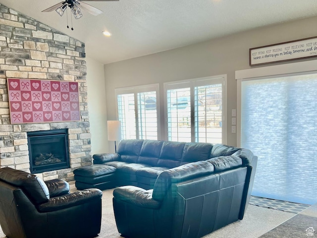 1048 N 200 E, Nephi, UT 84648 - carpeted living room featuring ceiling fan, vaulted ceiling, a stone fireplace, a textured ceiling, and recessed lighting