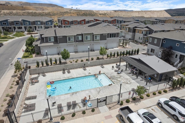 1011 W Lapis Fields Way S, Bluffdale, UT 84065 - aerial view of residential area featuring a pool area and a mountainous background