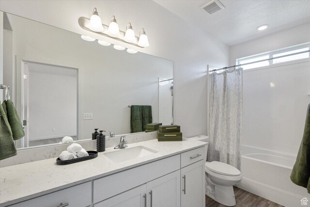 1011 W Lapis Fields Way S, Bluffdale, UT 84065 - full bath with wood finished floors, vanity, shower / bath combo with shower curtain, and a textured ceiling