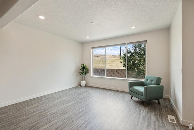 1011 W Lapis Fields Way S, Bluffdale, UT 84065 - unfurnished room with wood finished floors, a textured ceiling, and recessed lighting