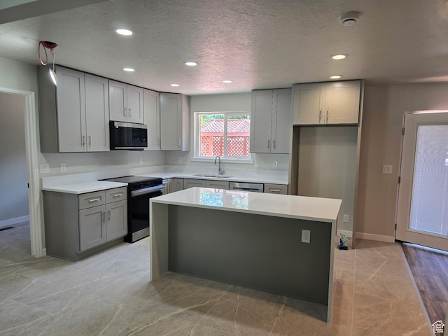8483 S Terrace Dr, Sandy, UT 84093 - kitchen featuring electric stove, stainless steel microwave, gray cabinets, recessed lighting, and a center island