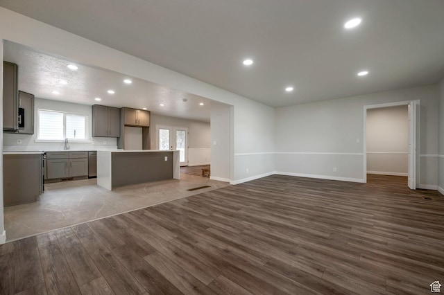 8483 S Terrace Dr, Sandy, UT 84093 - unfurnished living room featuring wood finished floors and recessed lighting