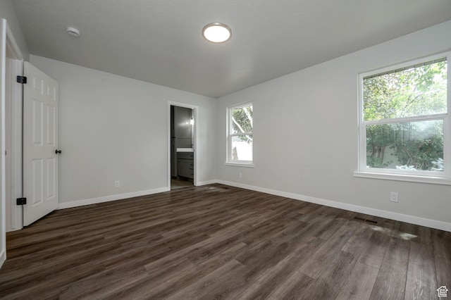 8483 S Terrace Dr, Sandy, UT 84093 - unfurnished bedroom with dark wood-type flooring and connected bathroom