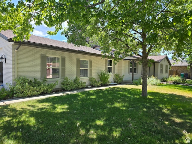 8483 S Terrace Dr, Sandy, UT 84093 - ranch-style home featuring brick siding, a front yard, and roof with shingles