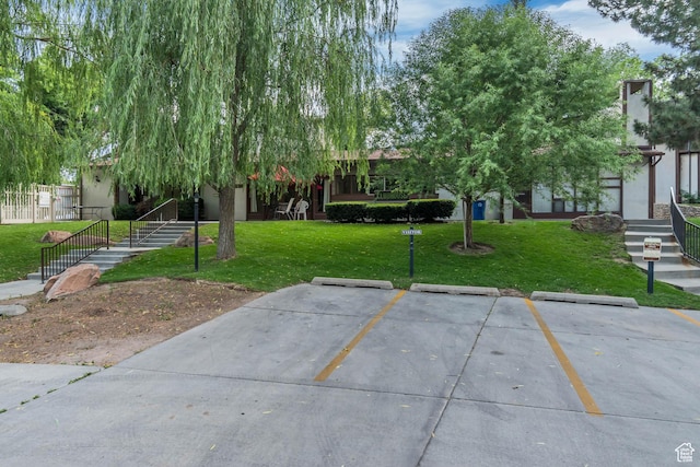5398 S Tonalea Dr, Salt Lake City, UT 84107 - view of community featuring uncovered parking and a yard
