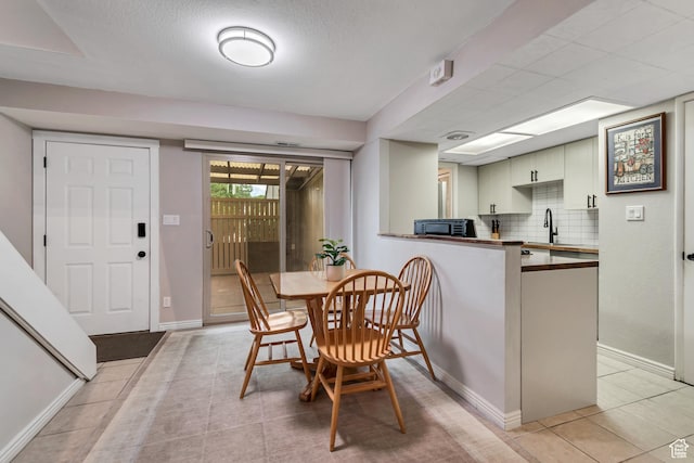 5398 S Tonalea Dr, Salt Lake City, UT 84107 - dining room featuring light tile patterned flooring and baseboards