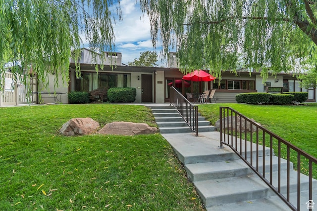 5398 S Tonalea Dr, Salt Lake City, UT 84107 - view of front of property featuring stucco siding, stairs, and a front yard