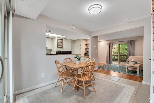 5398 S Tonalea Dr, Salt Lake City, UT 84107 - dining space with light tile patterned flooring and baseboards