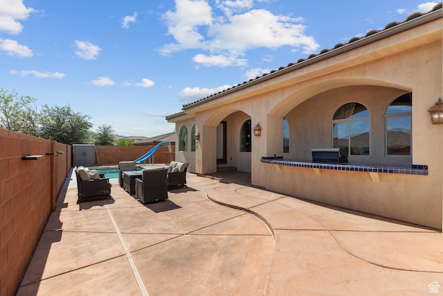 480 W Tonapah Way, Ivins, UT 84738 - fenced backyard featuring an outdoor hangout area and a patio